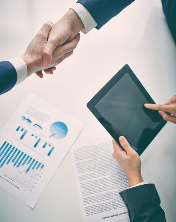 Managers shaking hands upon agreement